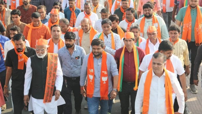 BJP leader Hardik Patel (centre) during poll campaign at Gujarat's Viramgam | Twitter | @HardikPatel_
