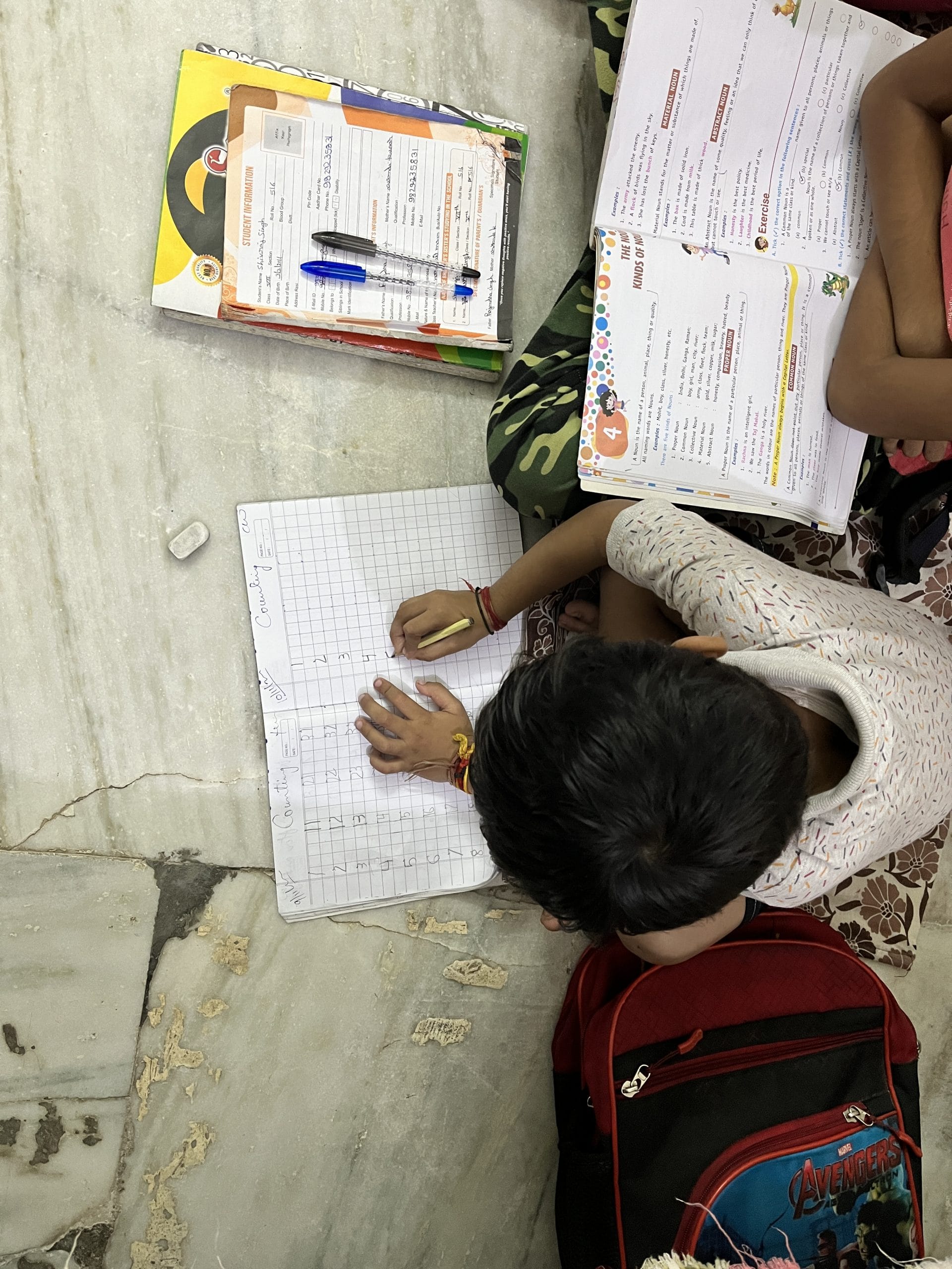 Kanishak writing in his notebook | Jyoti Yadav, ThePrint