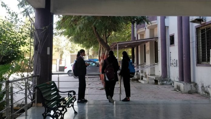 Some students stand about at the Government New Law College in Indore, Madhya Pradesh | Sukriti Vats | ThePrint