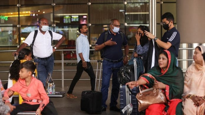 Passengers wait with their luggage at the Chhatrapati Shivaji Maharaj International Airport in Mumbai, India| Reuters/Francis Mascarenhas