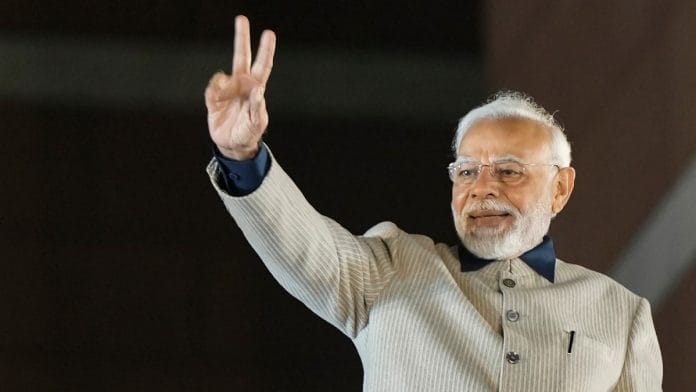 PM Narendra Modi flashes victory sign during the celebrations of BJP's victory in the Gujarat Assembly elections, at BJP HQ in New Delhi, on 8 December 2022 | PTI