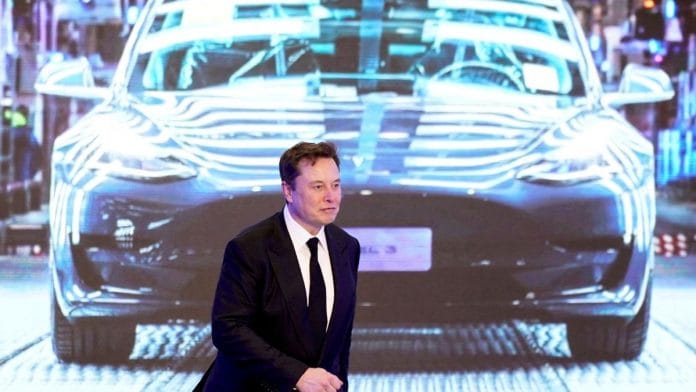 Tesla Inc CEO Elon Musk walks next to a screen showing an image of Tesla Model 3 car during an opening ceremony for Tesla China-made Model Y program in Shanghai, China | Reuters/Aly Song/File Photo