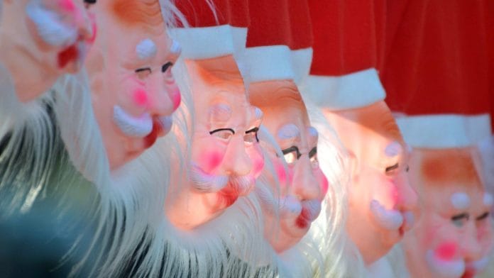 Santa Claus masks up for sale in Bhopal | ANI file photo