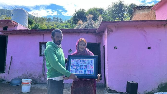 Sumit Kumar's parents holding a huge collage of the last photos of him | Jyoti Yadav, ThePrint