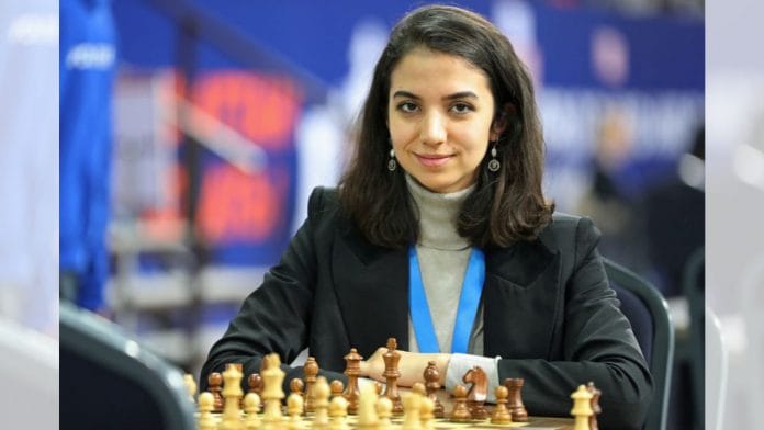 Sara Khadem of Iran sits in front of a chess board at FIDE World Rapid and Blitz Championships on Wednesday | Reuters