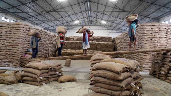 File photo of workers unloading sacks of foodgrain in a godown Jammu. | ANI