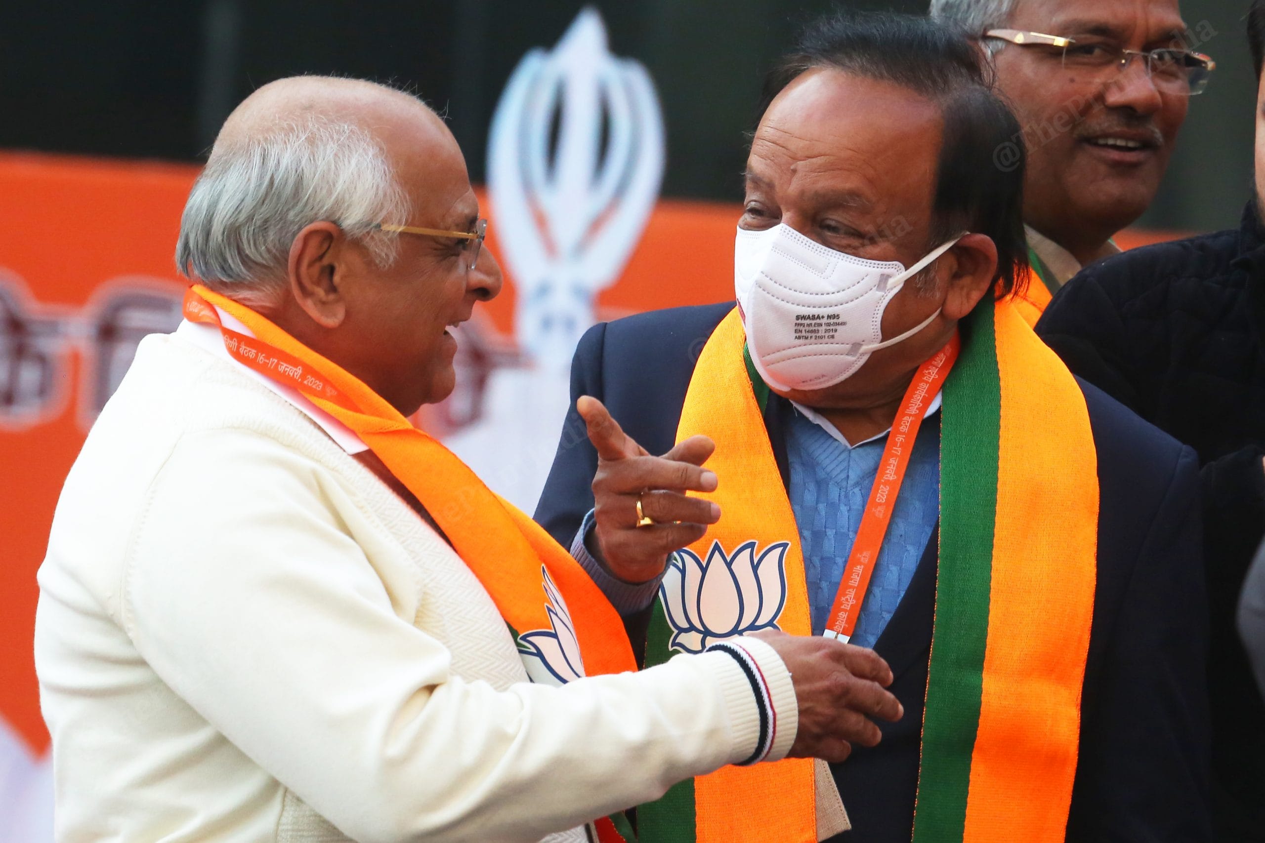 BJP leader Harsh Vardhan meets Gujarat CM Bhupendra Patel before entering the convention hall | Photo: Praveen Jain | ThePrint