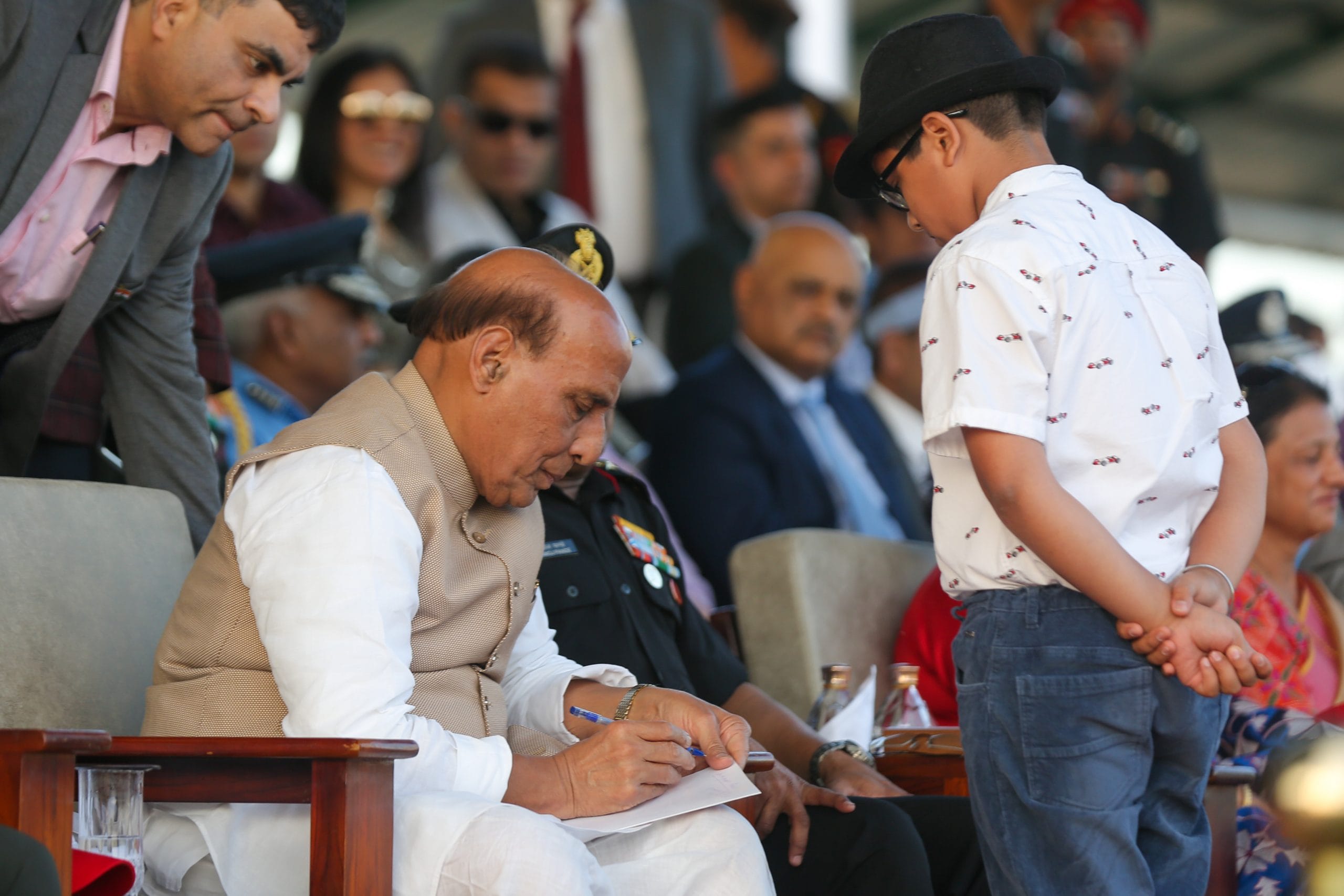 Raksha Mantri signing an autograph | Suraj Singh Bisht | ThePrint