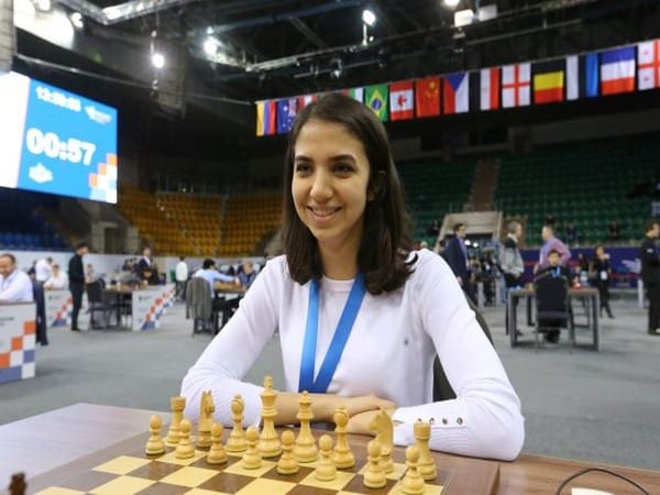 Iranian chess player warned not to return home after competing without hijab abroad