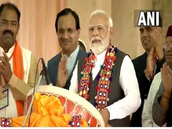PM Modi plays traditional drum during public rally in Karnataka's Kalaburagi