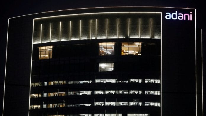 The logo of the Adani Group is seen on the facade of its Corporate House on the outskirts of Ahmedabad | Reuters file photo