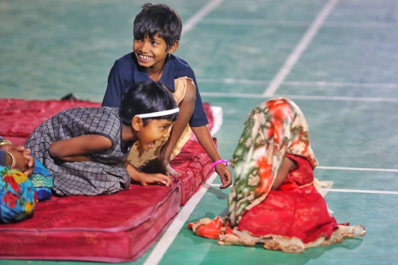 As a group of kids enact a scene from a wedding, the toddle who plays the bride, covers her face | Photo: Praveen Jain | ThePrint