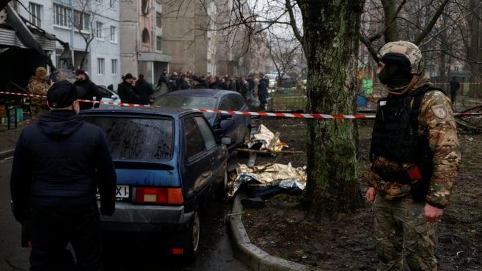 Dead bodies lie on the ground at the site where a helicopter falls on civil infrastructure buildings, amid Russia's attack on Ukraine, in the town of Brovary, outside Kyiv, Ukraine, on 18 January 2023 | Reuters