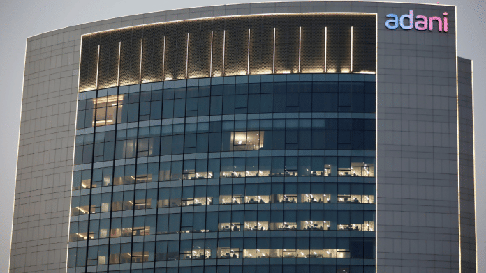 The logo of the Adani Group is seen on the facade of one of its buildings on the outskirts of Ahmedabad, India, April 13, 2021 | Reuters/Amit Dave