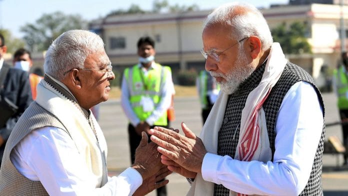 Prime Minister Narendra Modi being received by Madhya Pradesh Governor Mangubhai C. Patel upon his arrival in Indore for the Pravasi Bharatiya Divas convention | PTI photo