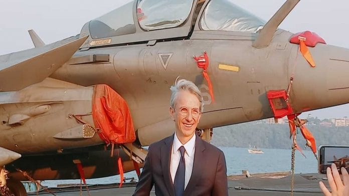 Photo caption: French envoy Emmanuel Lenain on board  Charles De Gaulle with Rafale M behind him | Shyam Nandan Upadhyay | ThePrint 