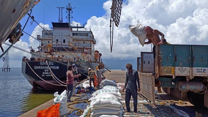 Labourers unload rice bags from a supply truck at India's main rice port at Kakinada Anchorage in the southern state of Andhra Pradesh | Reuters file photo