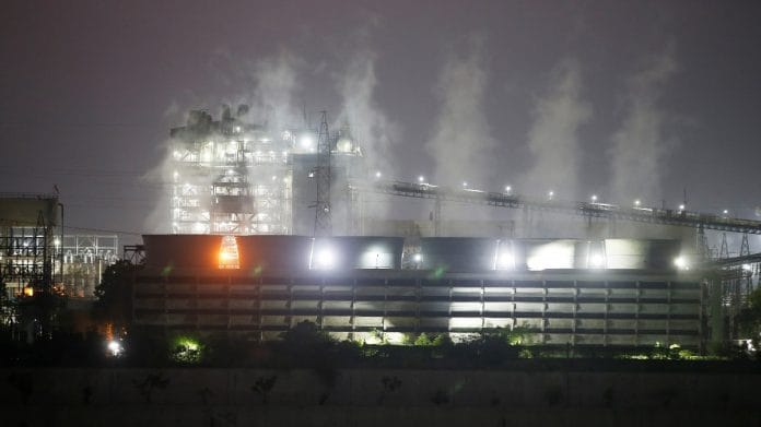 Smoke billows from the cooling towers of a coal-fired power plant in Ahmedabad | Representational image | Reuters file photo/Amit Dave