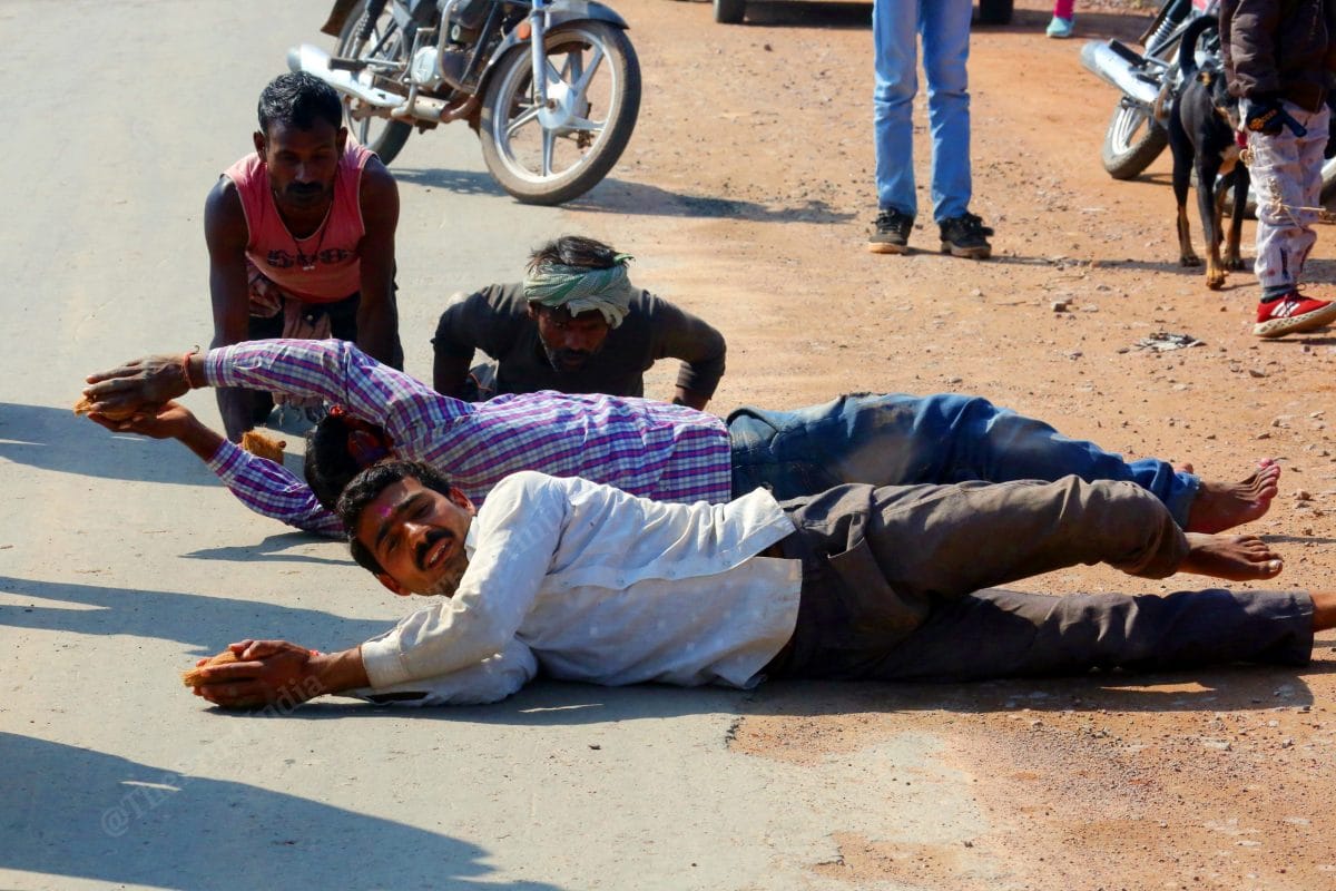 Followers roll all the way to the temple in a customary ritual | Photo: Praveen Jain | ThePrint