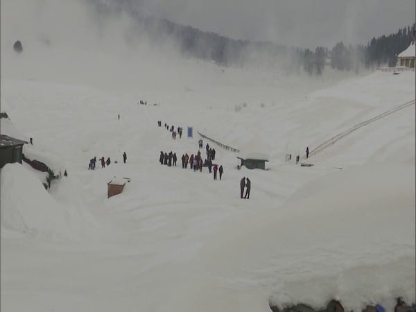 Kashmir: Tourists flock to Gulmarg as snow covers ski resort 