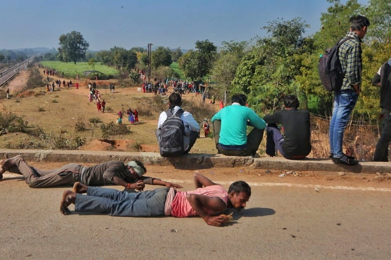 Some followers crawl their way to the temple | Photo: Praveen Jain | ThePrint
