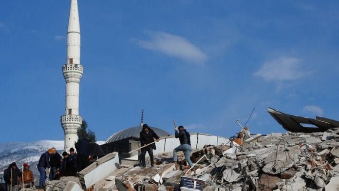 Rescuers work at the site of a damaged building in the aftermath of a deadly earthquake in Kahramanmaras, Turkey on 8 February, 2023 | Reuters