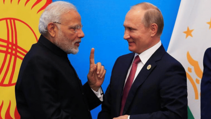 India's Prime Minister Narendra Modi and Russia's President Vladimir Putin attend a signing ceremony during Shanghai Cooperation Organization (SCO) summit in Qingdao, Shandong Province, China June 10, 2018. REUTERS/Aly Song