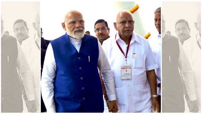 PM Narendra Modi with former Karnataka chief minister B.S. Yediyurappa at inauguration of airport in Shivamogga on Monday | Twitter | @blsanthosh