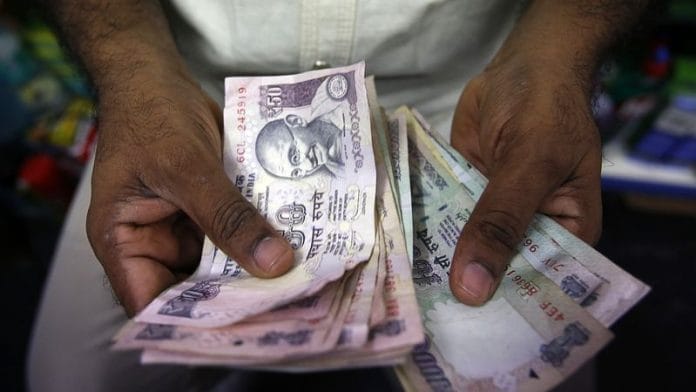 A private money trader counts Indian Rupee currency notes at a shop in Mumbai | File Photo: Reuters