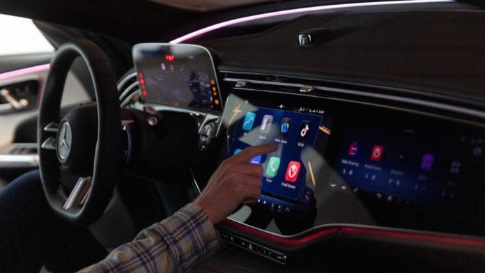 A guest looks at the dashboard display of a Mercedes-Benz prototype during a strategy update event focused on software in Sunnyvale, California | Reuters