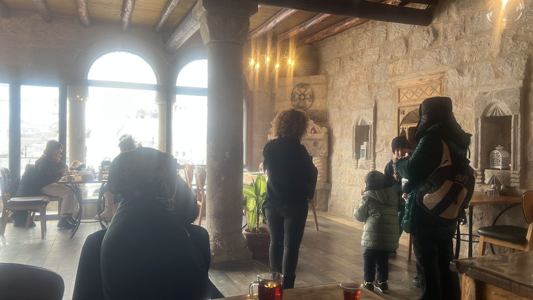 Women and children fleeing quake-hit areas arrive in Tekkaya Cave Hotel, Nevşehir, Turkey | By special arrangement]