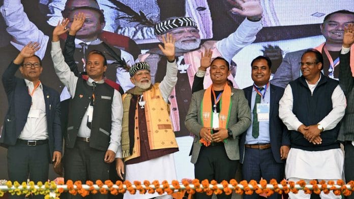 Prime Minister Narendra Modi along with Bharatiya Janata Party (BJP) leaders wave to the supporters during a public rally ahead of the Meghalaya Assembly elections, at Tura, in West Garo Hills on Friday | ANI