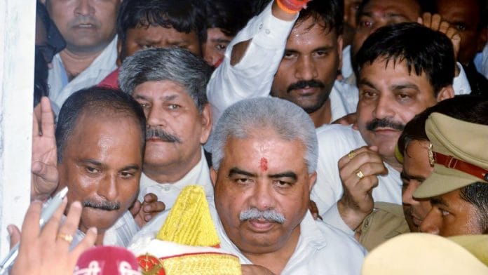 File photo of UP minister Rakesh Sachan once he got bail after being sentenced to 1 year in jail under Arms Act, in Kanpur last year | ANI