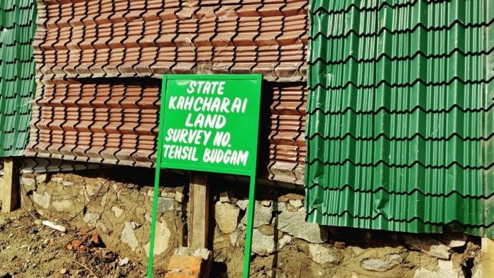 A board outside the demolished property of senior National Conference leader Ali Mohammad Sagar
