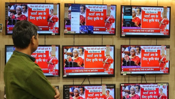 People watch as Finance Minister Nirmala Sitharaman presents Budget 2023 in parliament. ThePrint photo by Suraj Singh Bisht