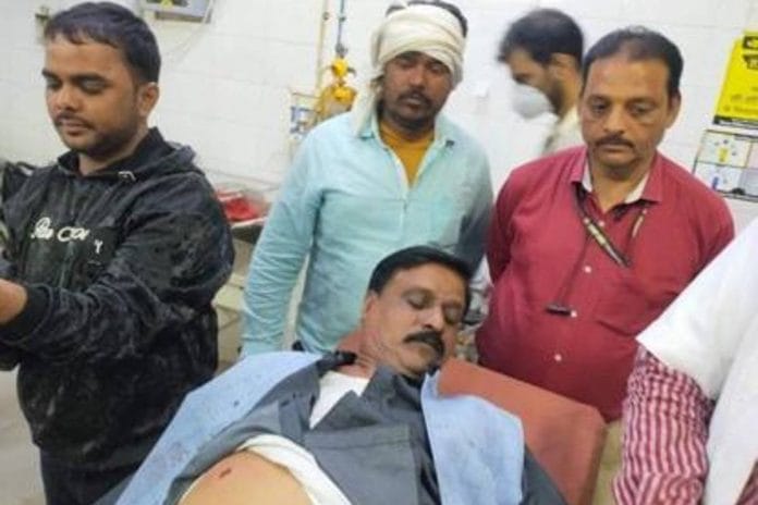 Devedra Khare (lying) after being shot at | By special arrangement