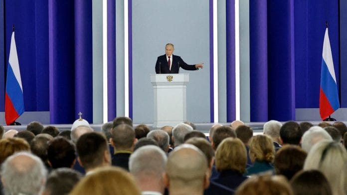 Russian President Vladimir Putin delivers his annual address to the Federal Assembly in Moscow, on 21 February 2023 | Sputnik/Dmitry Astakhov/Kremlin via Reuters