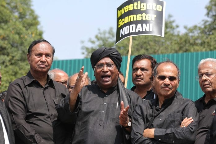 Congress President Mallikarjun Kharge along with MPs of other like-minded opposition parties wearing black addresses media personnel at Vijay chowk in New Delhi on Monday | Photo: ThePrint/Suraj Singh Bisht
