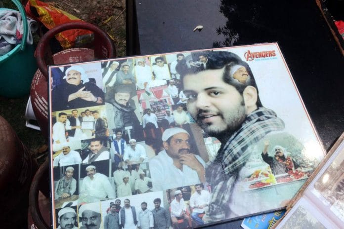 A banner with the images of Atiq Ahmed (with moustache), prime suspect in Umesh Pal murder, seen during the demolition of an associate’s house in Prayagraj Wednesday. While the authorities say they are targeting illegal structures, the demolition is seen as part of a crackdown against Ahmed and associates | ANI