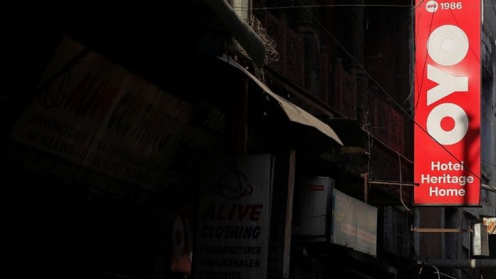 File photo of the logo of OYO, installed on a hotel building is pictured in an alley in New Delhi, India, 3 April 3, 2019 | Reuters