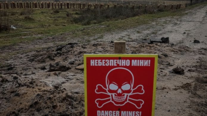 File photo of a mine danger sign & anti-tank constructions are seen near the border with Belarus, amid Russia's attack on Ukraine in Volyn region, Ukraine 13 January, 2023 | Reuters