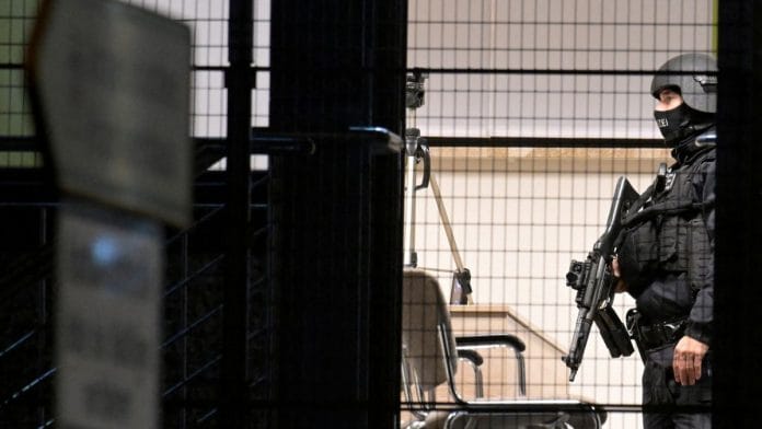 Special police inside the building after at least six people are dead and several more injured in a shooting in the northern German city of Hamburg, Germany, March 10, 2023 | Reuters/Fabian Bimmer