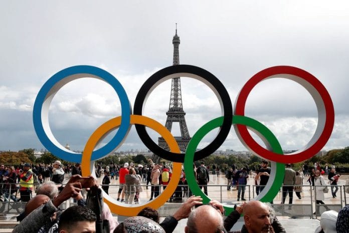Olympic rings to celebrate the IOC official announcement that Paris won the 2024 Olympic bid are seen in front of the Eiffel Tower | Reuters file photo