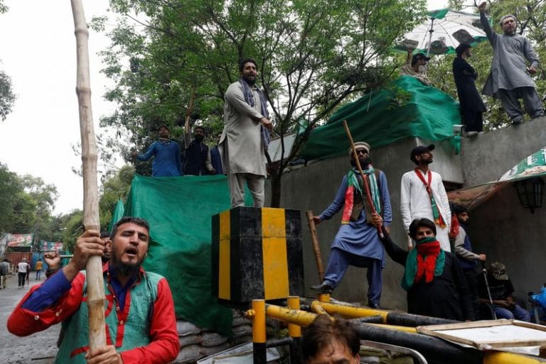 Imran Khan’s supporters barricade Lahore home as Pakistan awaits court’s ruling on arrest