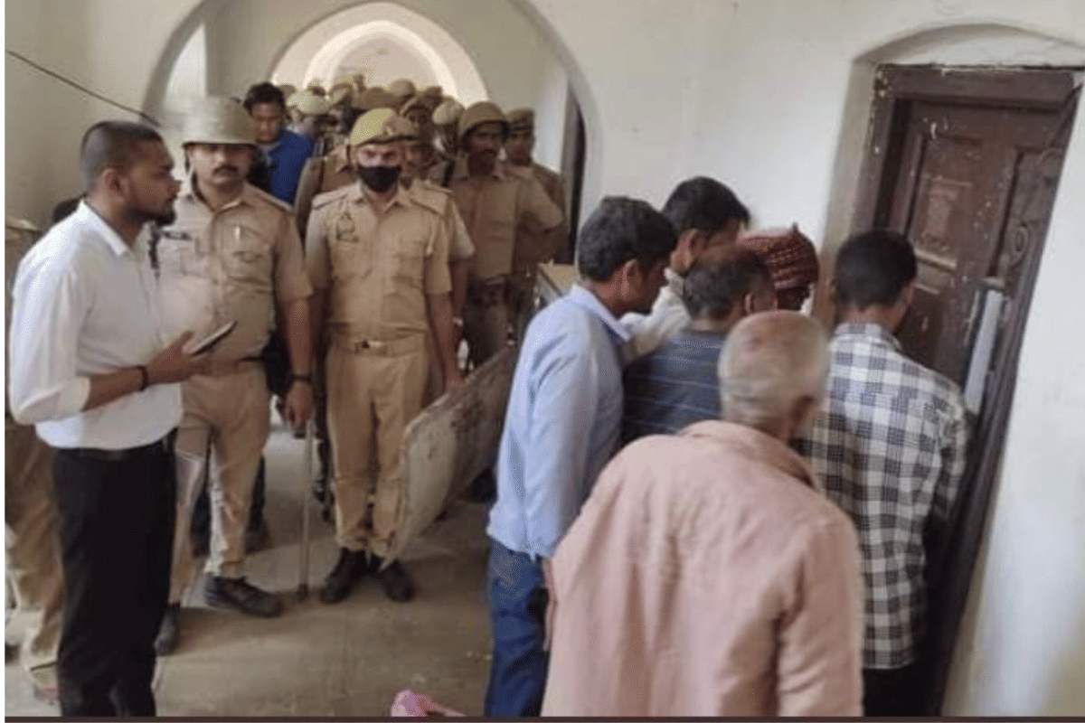 Police officers sealing the Muslim Boarding House. | Twitter