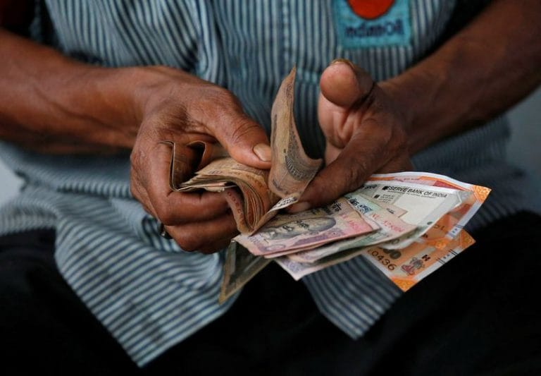 Rupee holds up well to dollar’s rally, almost unchanged week-on-week