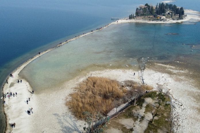 File photo of a drone image shows San Biagio island, affected by drought, near Lido di Manerba, Italy, February 21, 2023 | Reuters