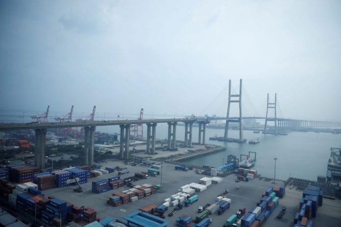 File photo of cranes and shipping containers seen at Pyeongtaek port in Pyeongtaek, South Korea, 9 July, 2020 | Reuters