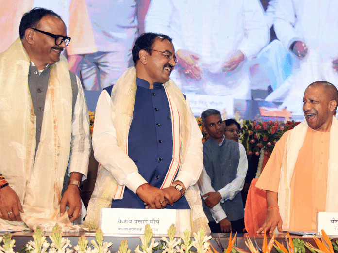 Uttar Pradesh Chief Minister Yogi Adityanath interacts with State Deputy Chief Ministers Keshav Prasad Maurya and Brajesh Pathak at the press conference to mark his government’s sixth year  | ANI