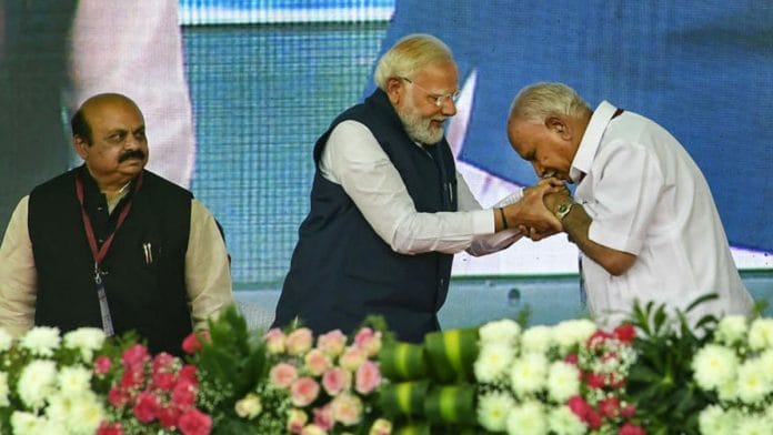 From left to right: Basavaraj Bommai, Narendra Modi and BS Yediyurappa at Karnataka public meeting | PTI